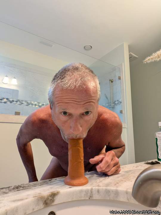 sucking a dildo