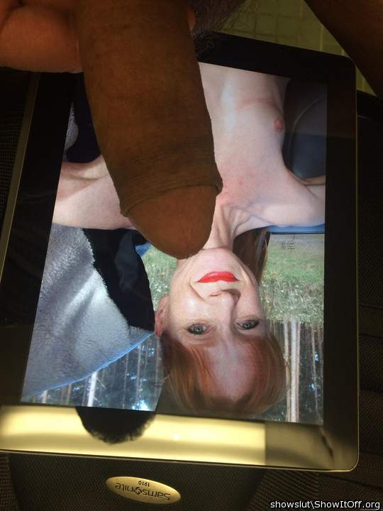 A redheaded slut with a smile and a cock