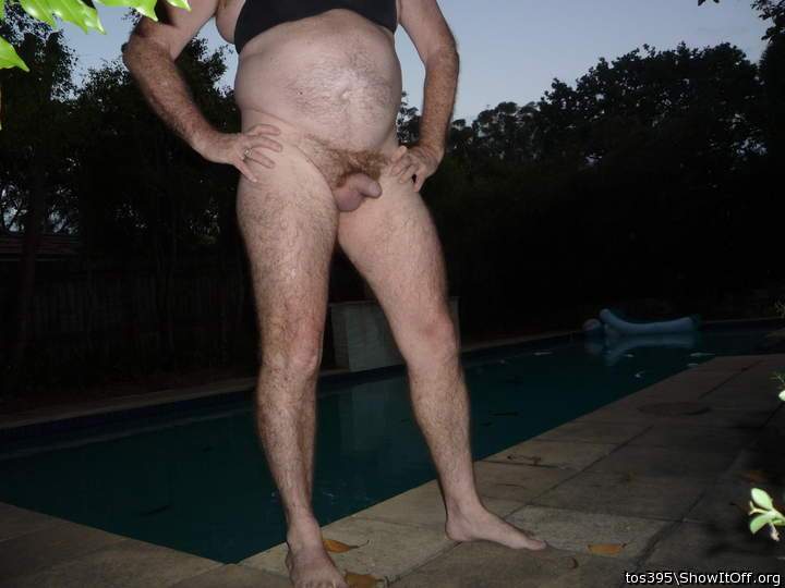 black bra & big belly near the pool