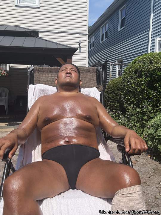 Black thong sunbathing in my backyard