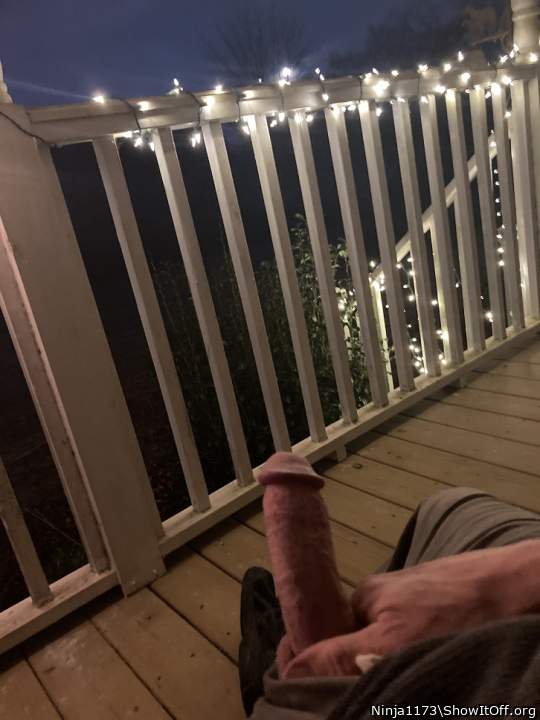 On the front porch, hoping someone will walk or drive by